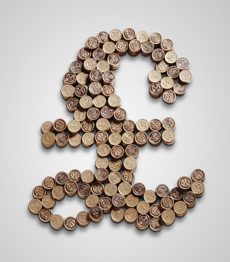 A pound sign made of pound coins Photograph by John Rensten
