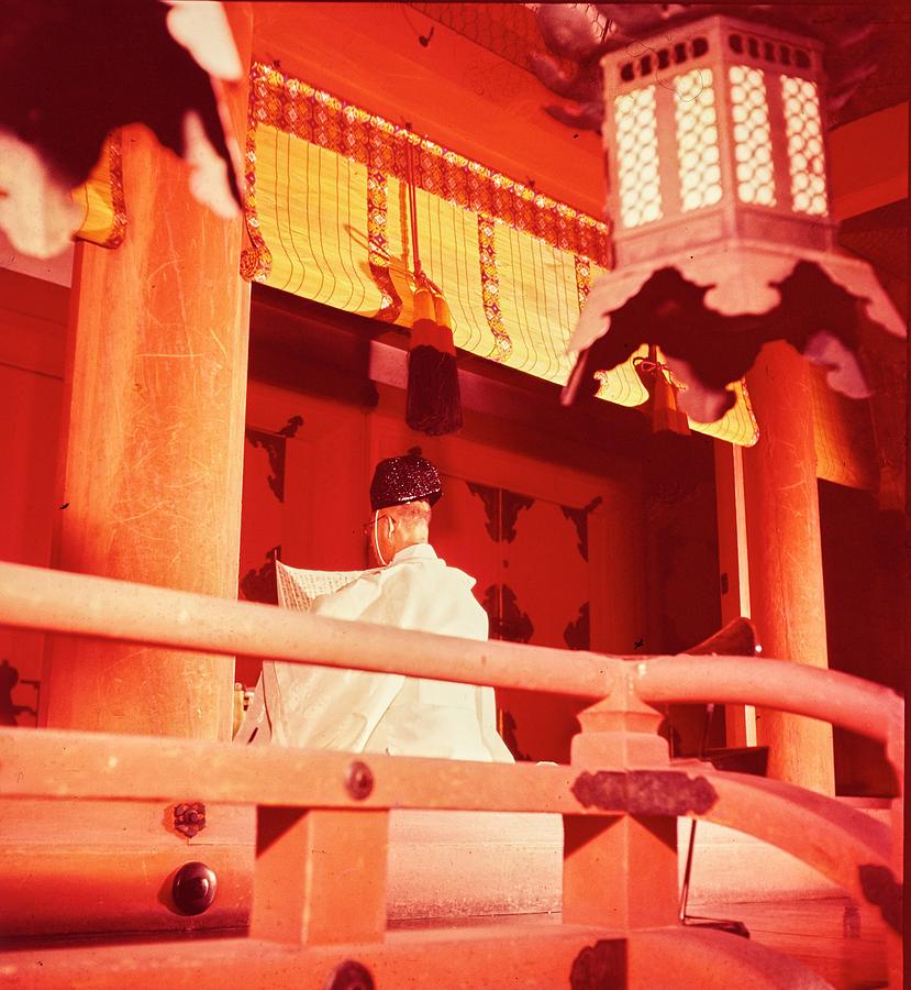 A Priest Praying In A Shinto Shrine Photograph by Nick De Morgoli