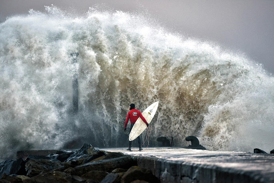 A Pro-surfer Waits For A Break In The Photograph by Charles Mcquillan