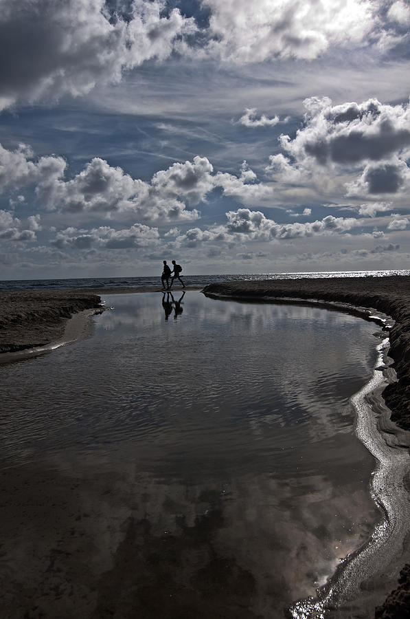 Son Bou beach in Menorca with a cloudy sky - a promenade by the clouds Photograph by Pedro Cardona Llambias