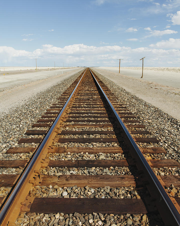 A railroad extending through the desert,near Wendover in Utah. Photograph by Mint Images - Paul Edmondson
