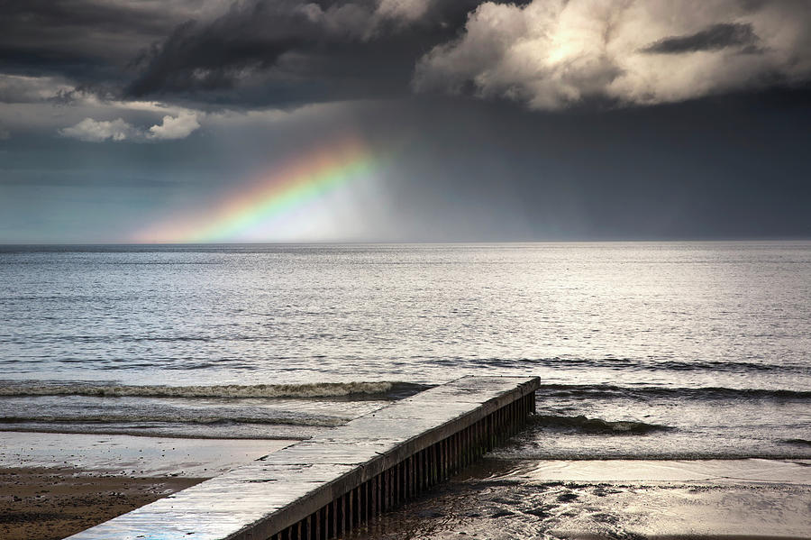 A Rainbow Shining In The Storm Clouds Photograph by John Short / Design Pics