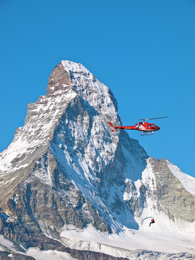 A Rescue Working Is Dangling Photograph by Menno Boermans A Rescue Working Is Dangling Photograph by Menno Boermans