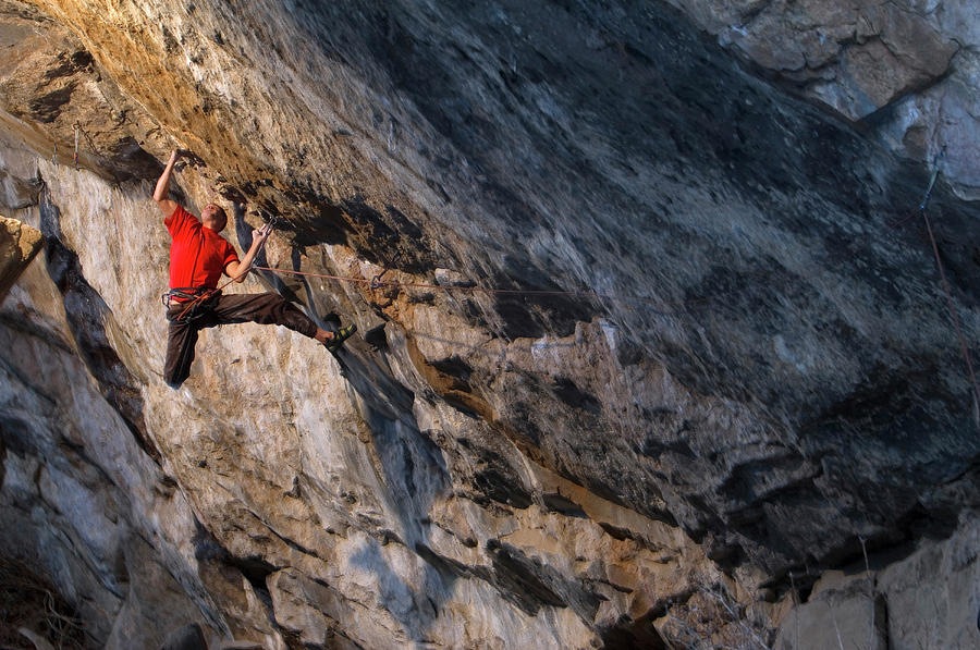 A Rock Climber In A Red Shirt Climbing Photograph by Keith Ladzinski ...