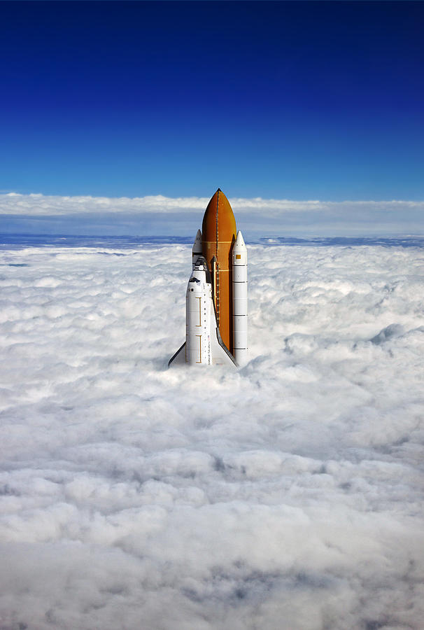 A rocket sticking out of a blanket of cloud. Photograph by Richard Silvera