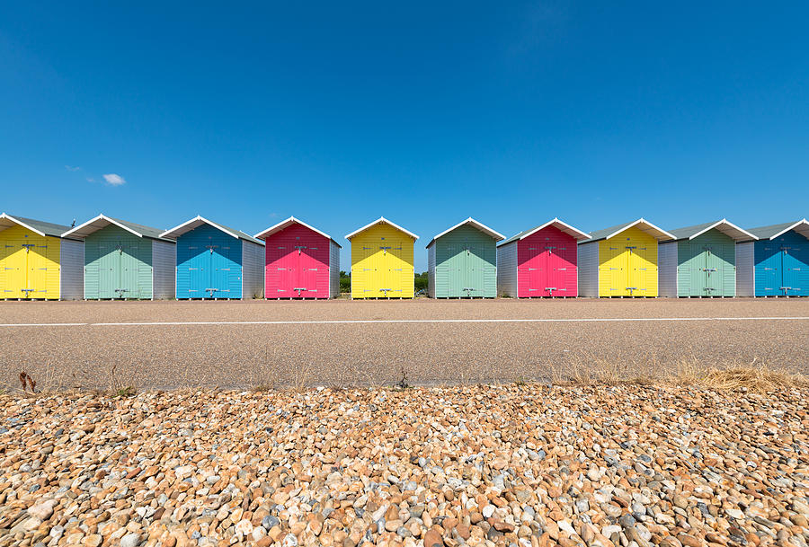 A Row of Multi-Coloured Beach Huts along the Promenade, Eastbourne, East Sussex Photograph by Tim Grist Photography
