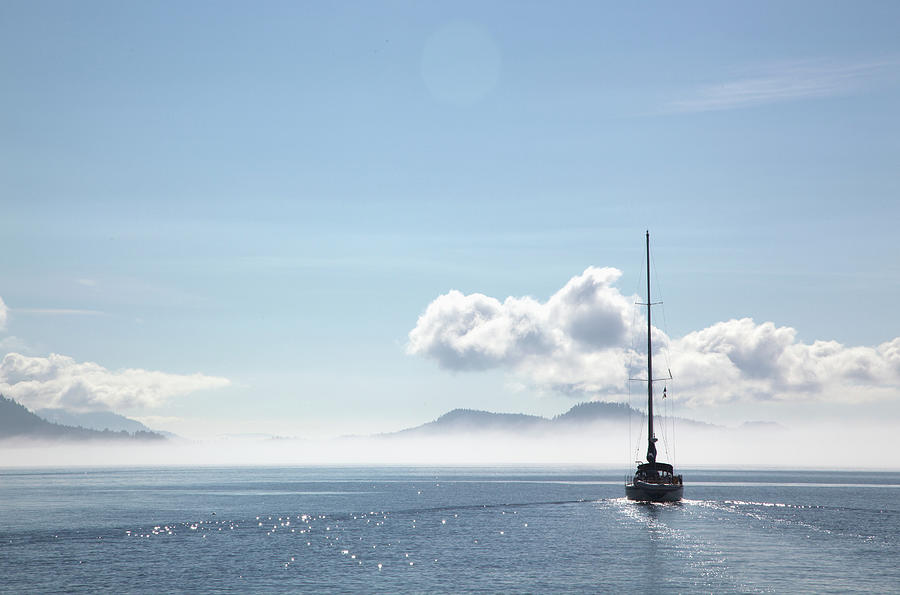 A Sailboat Cruises On A Sunny Day In Photograph by Debra Brash / Design Pics