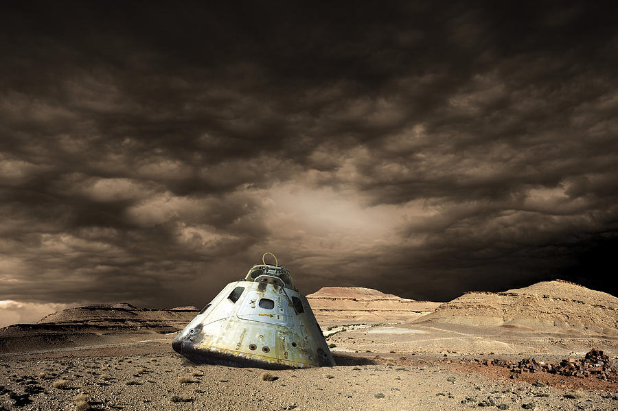 A scorched space capsule lies abandoned on a barren world.  Drawing by Marc Ward/Stocktrek Images