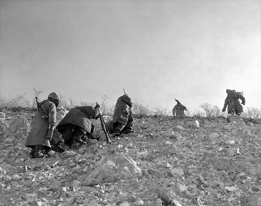 A Seventh Marine patrol fights its way up a frozen mountain side ...