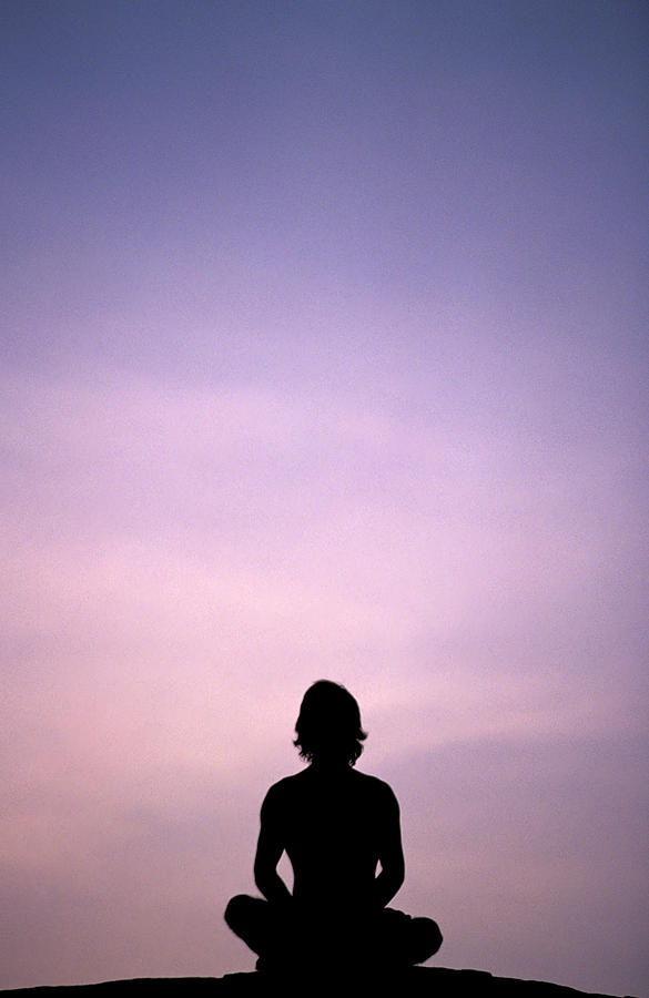 Sunset Photograph - A Silhouette Of A Man Meditating by Corey Rich
