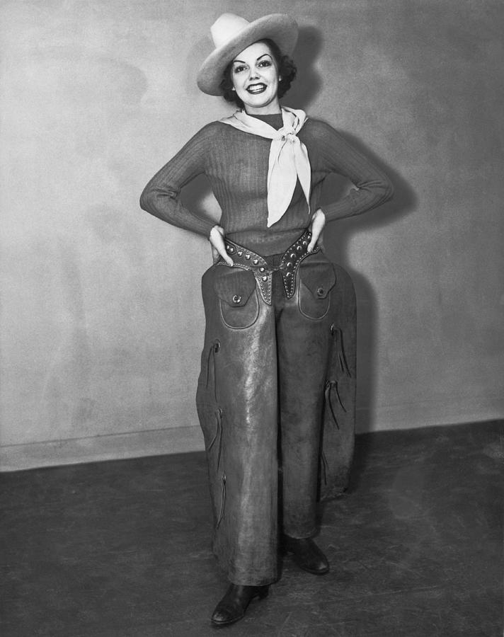 Black And White Photograph - A Smiling Cowgirl by Underwood Archives
