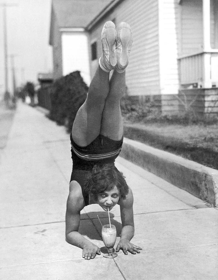 California Girl Imbibes Soda Upside Down Photograph by Underwood Archives