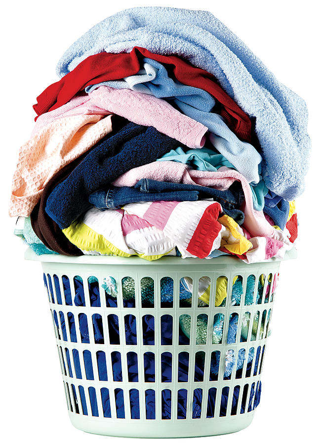 A stack of dirty laundry in a basket Photograph by Omersukrugoksu