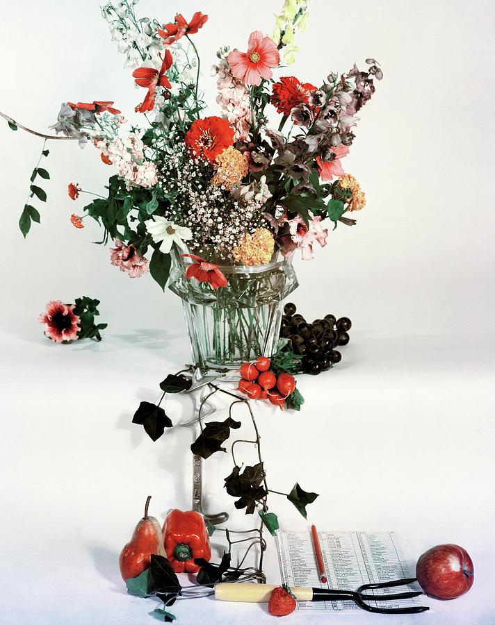 A Studio Shot Of A Vase Of Flowers And A Garden Photograph by Herbert Matter