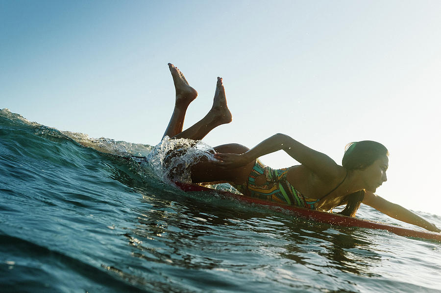 Nature Photograph - A Surfer Girl In A Bikini Paddles by Sergio Villalba
