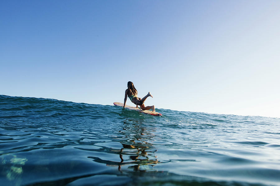 Nature Photograph - A Surfer Girl Paddles On Her Longboard by Sergio Villalba