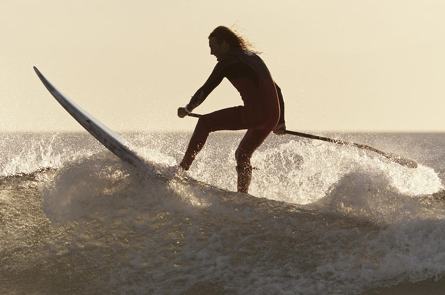 paddling a surfboard