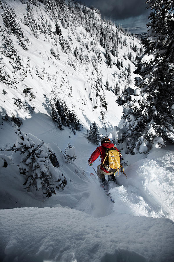 A Telemark Skier Jumping Into A Narrow Photograph by Patrick Orton ...