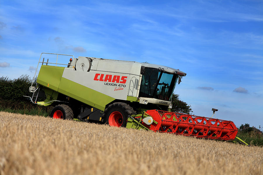 Combine Harvester Photograph - A Touch Of Claas by Paul Lilley