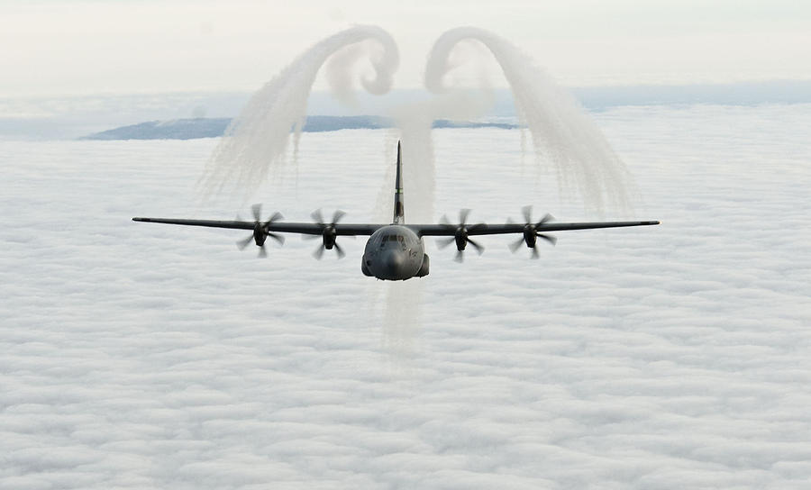 A U.S. Air Force C-130J Hercules cargo aircraft Photograph by Celestial Images