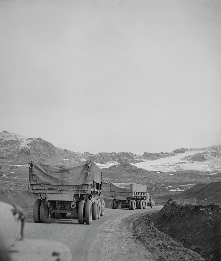 A U.s. Army Truck Convoy Climbing Photograph by Stocktrek Images