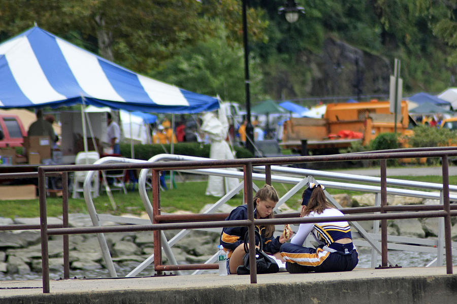 A View Of Two Cheerleaders Enjoying Some Lunch At Riverfront Gre Photograph