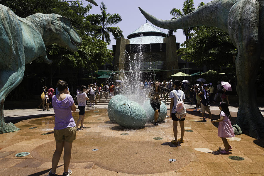 A water fountain with dinosaur eggs in Universal Studios Singapore Photograph by Ashish Agarwal