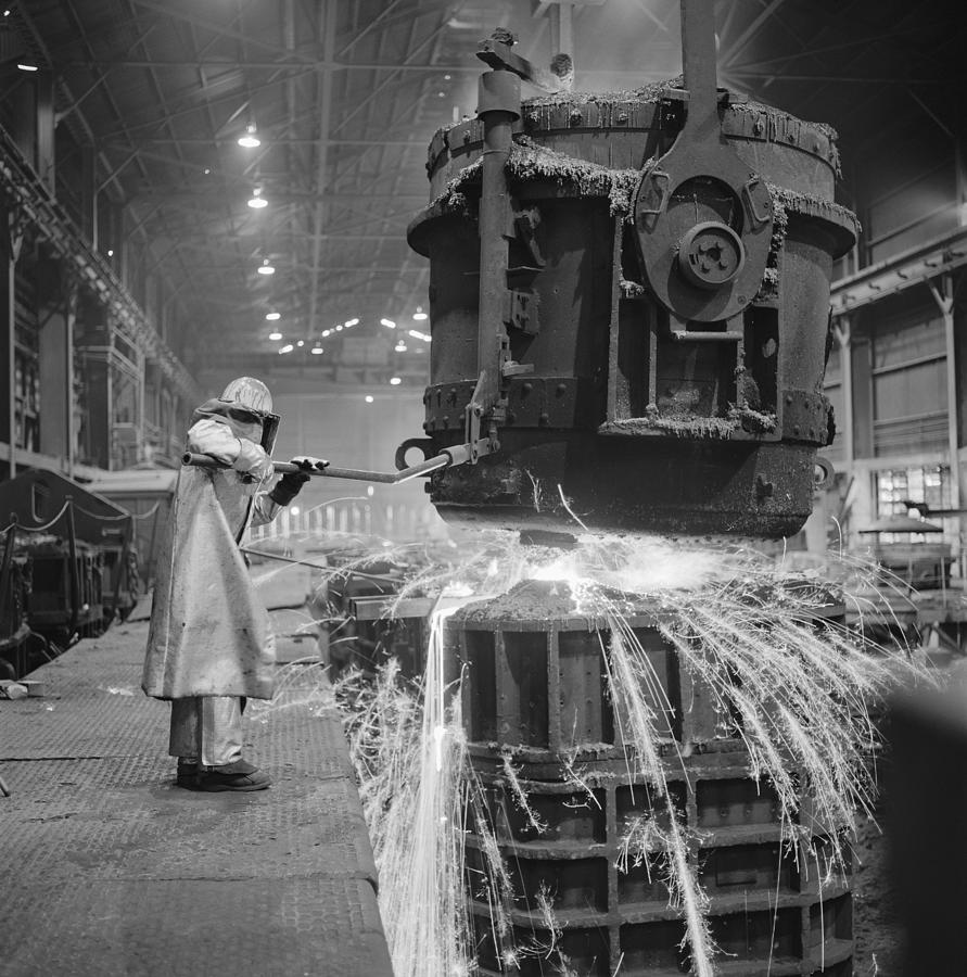 A Welder Works Hard In The Factory Where He Is Working With Fire And Metal Photograph by Photodisc