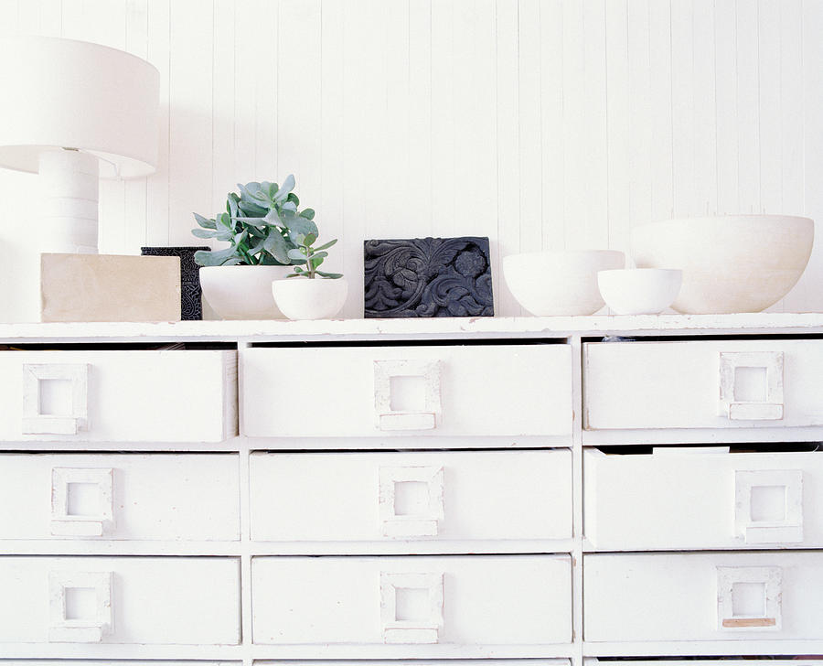 A white chest of drawers Photograph by Image Source