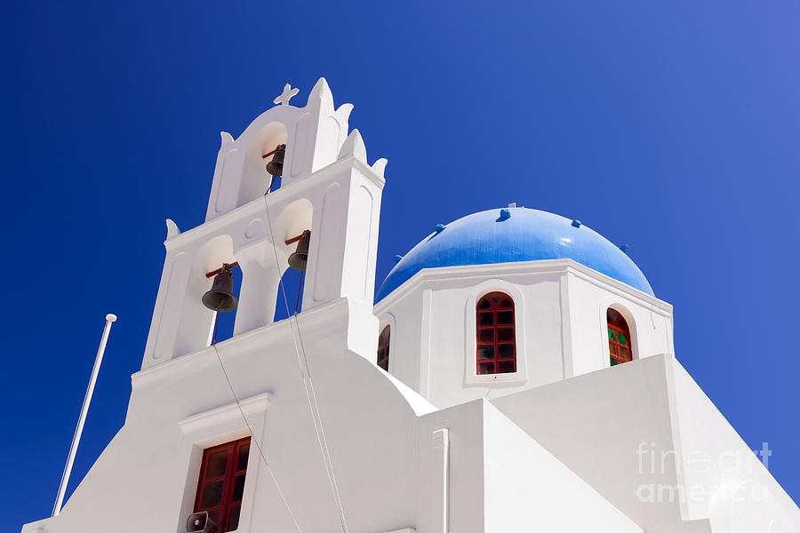 A white church with blue dome in Oia or Ia on Santorini island Greece Photograph by Michal Bednarek