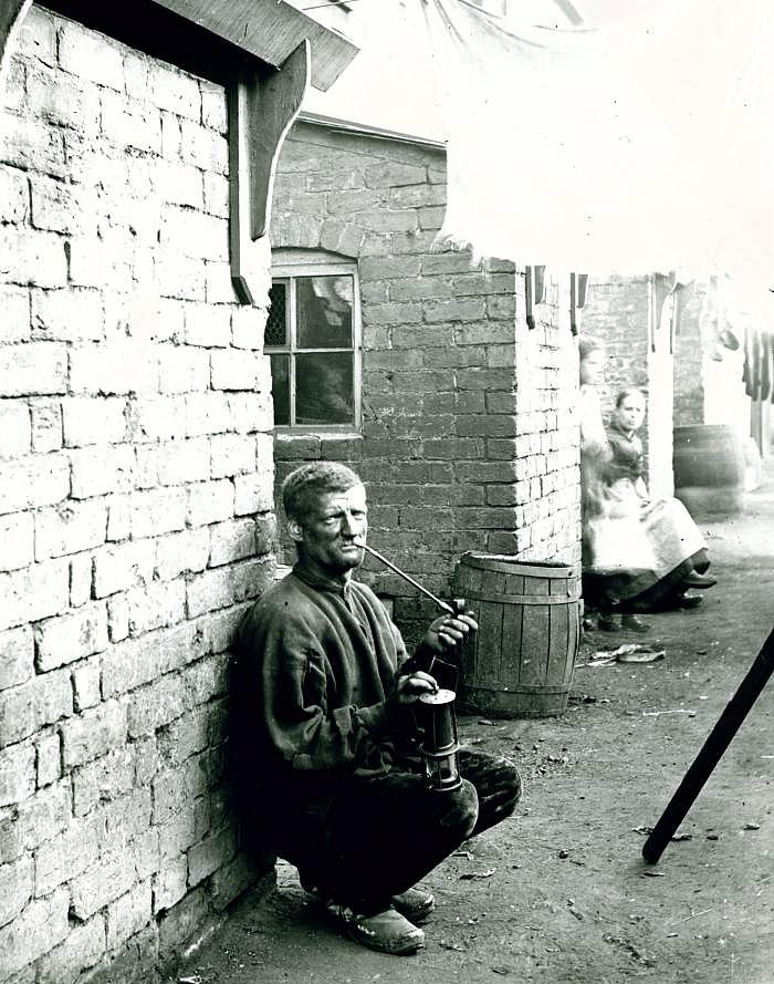 A Wigan miner kneeling down in a wash day alley Painting by MotionAge Designs