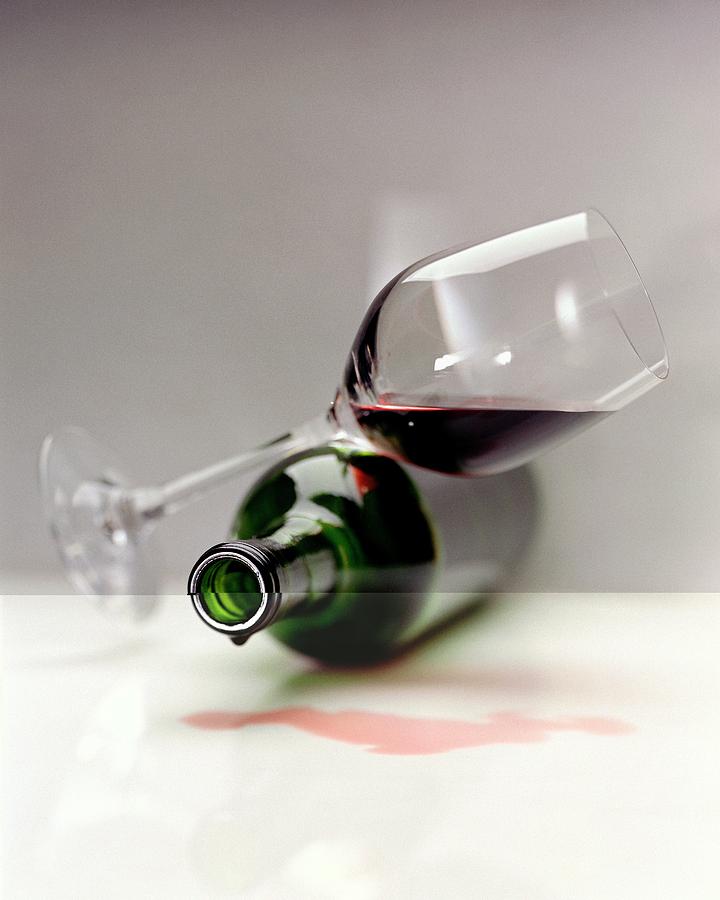 A Wine Bottle And A Glass Of Wine Photograph by Romulo Yanes