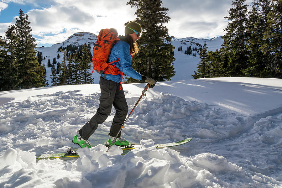 A Woman Backcountry Skiing On Red Photograph by Kennan Harvey