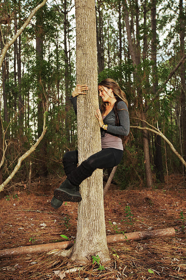 A Woman Climbs And Hugs A Tree Outdoors Photograph By Logan Mock Bunting