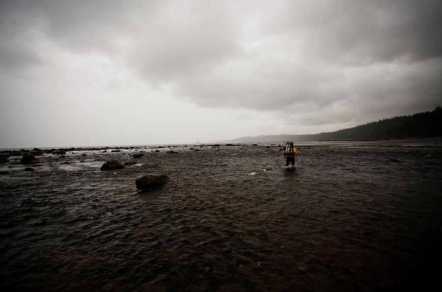 A Woman Crosses The Ozette River At Low Photograph by Michael Hanson ...