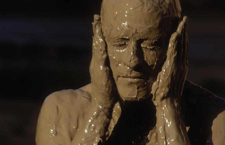 A Woman Grabs Her Mud-covered Face Photograph by Dawn Kish.
