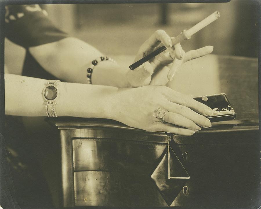A Woman Holding A Cigarette Holder Photograph by Edward Steichen