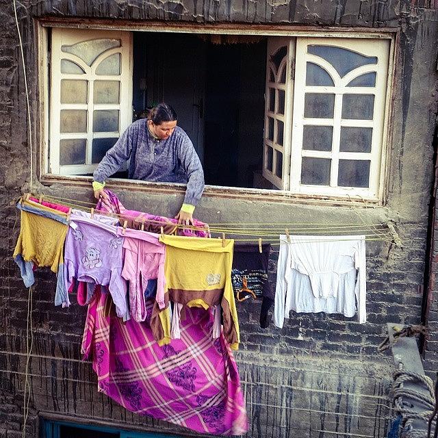 Maadi Photograph - A Woman Puts Out Her Freshly Washed by Mattias Pruym