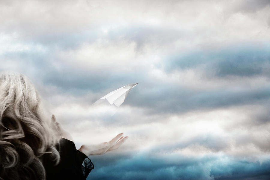 A Woman Releasing A Paper Plane Into Photograph by Andrew Bret Wallis A Woman Releasing A Paper Plane Into Photograph by Andrew Bret Wallis