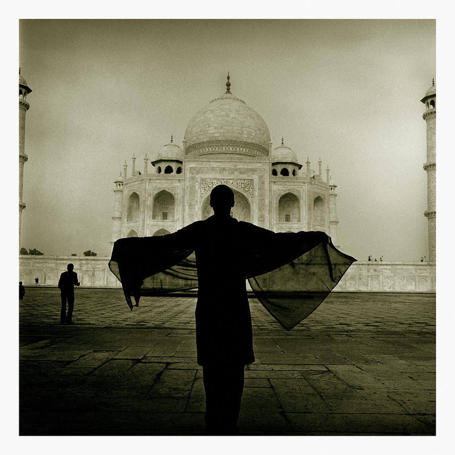 Buddha Photograph - A Woman Stands Near The Famous Taj by Simon ODwyer