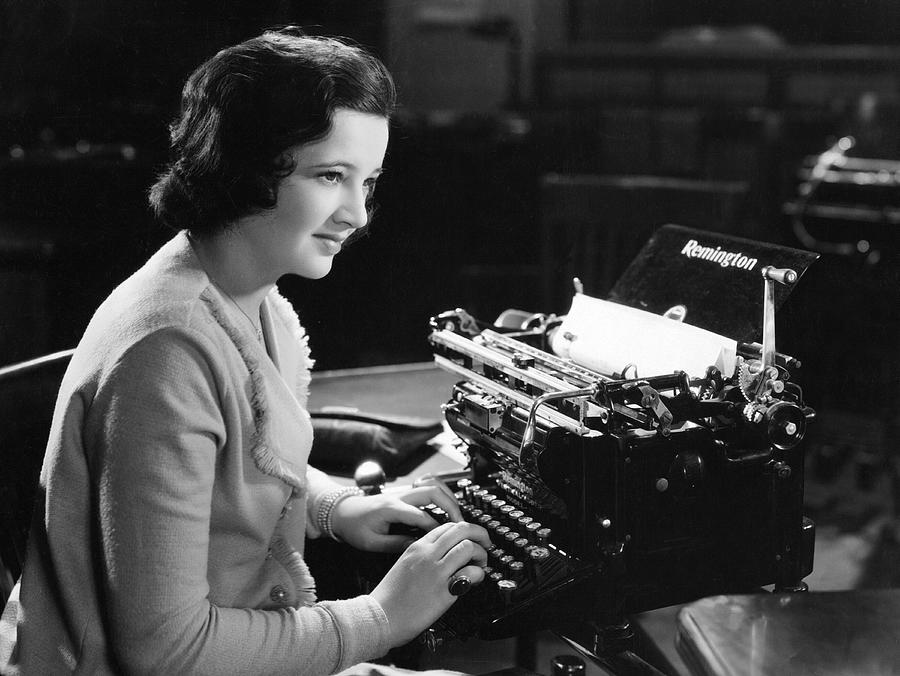A Woman Typing Photograph by Underwood Archives