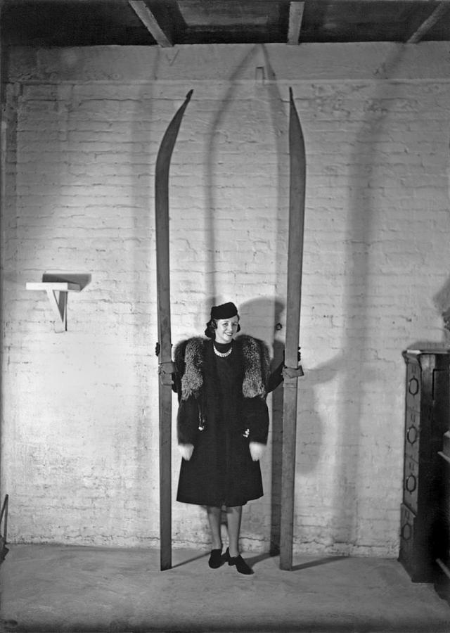 Black And White Photograph - A Woman With Nine Foot Skis by Underwood Archives