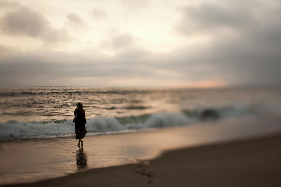 A Women Walks On A Beach At Sunset Photograph by Patrick Orton - Fine ...