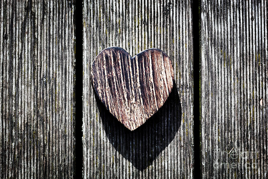 Vintage Photograph - A wooden vintage heart on grunge wood planks by Michal Bednarek