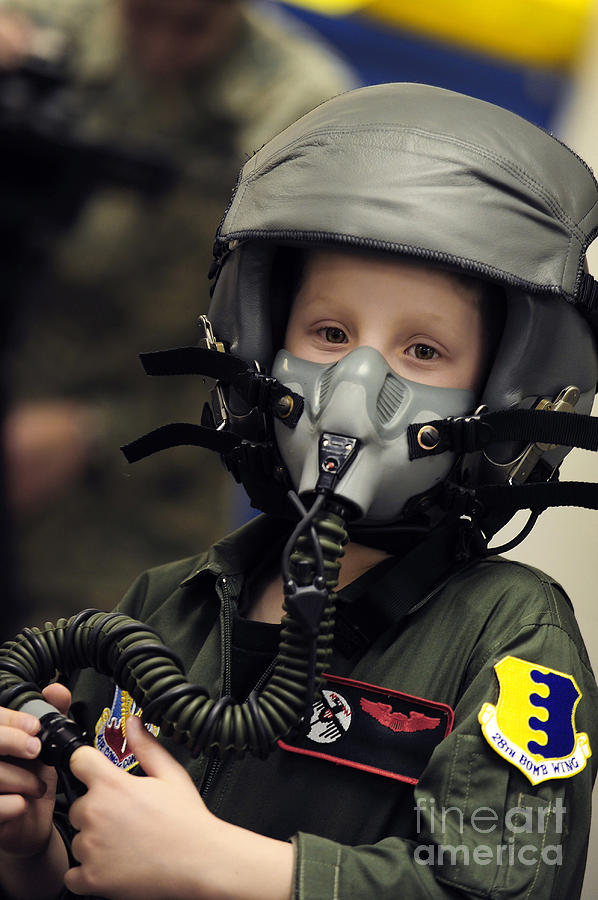 A Young Boy Wears A Helmet With Oxygen Photograph
