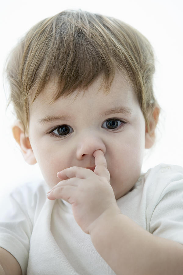 A young boy with a his finger up his nose Photograph by fStop Images - Vladimir Godnik