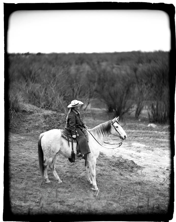 A Young Female Cowboy On A White Horse Photograph by Robb Kendrick ...