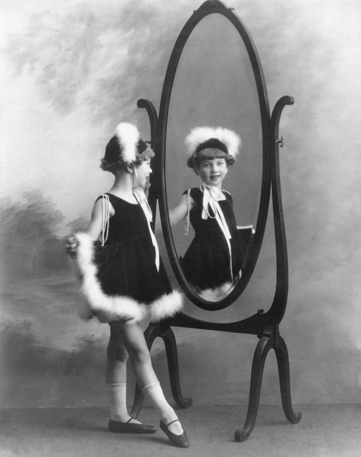 A Young Girl In A Mirror Photograph by Underwood Archives