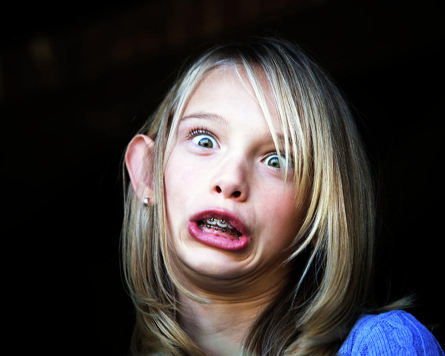 A Young Girl Making A Funny Face Photograph By Ron Koeberer