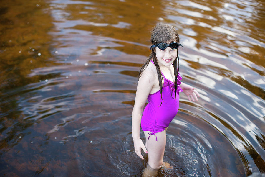 https://images.fineartamerica.com/images-medium-large-5/a-young-girl-wearing-a-bathing-suit-david-ellis.jpg